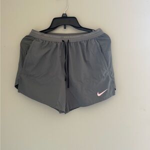 Nike Women's Gray Athletic Shorts with Pink Swoosh